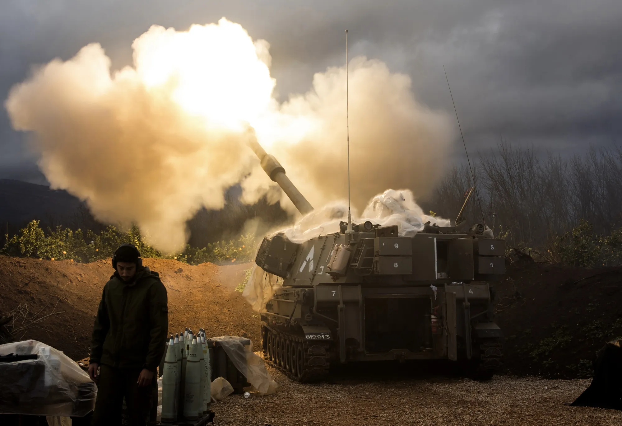 An Israeli artillery unit fires across the border towards Lebanon on Jan. 11.