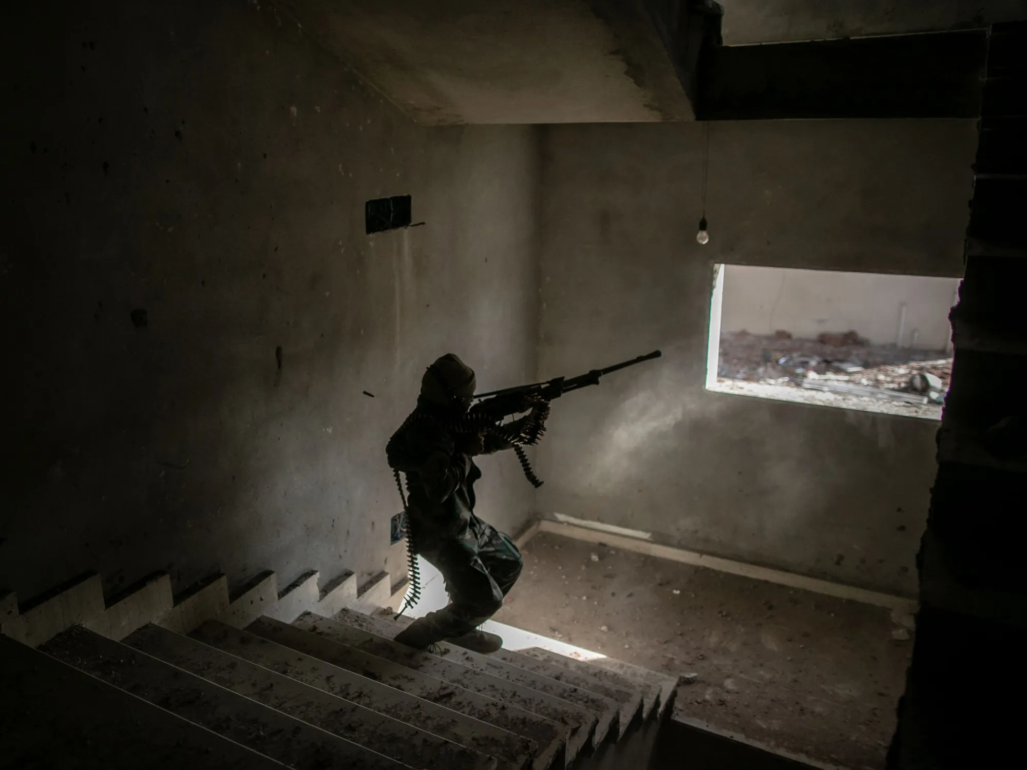 A fighter with the United Nations-backed&nbsp;Libyan government forces fires at a Libyan National Army position&nbsp;in Tripoli, Libya, on Feb. 26.