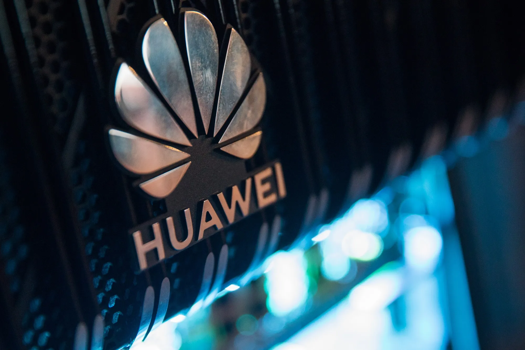 A corporate logo sits on a Huawei’s router on display during a 5G event in London
