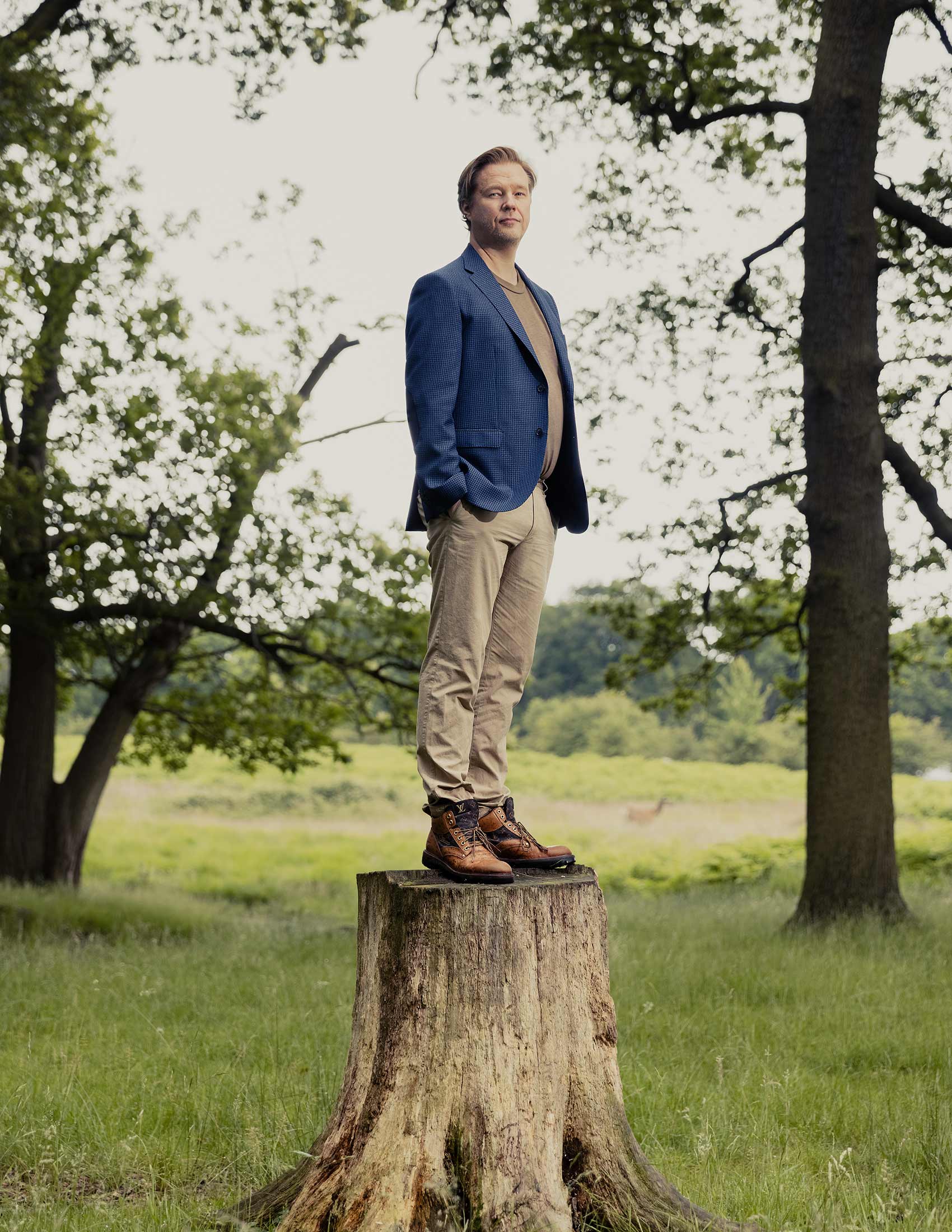 Ulf Ek stands on a tree stump in Richmond Park, London, 2021.