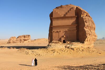 American tourist Birgit Mitchell visiting Mada'in Saleh, a UNESCO World Heritage Site, in Saudi Arabia, with her guide Yasser Al Imam. on Tuesday, Jan. 31, 2017. XXX ADD SECOND SENTENCE HERE XXX. Photographer: Vivian Nereim/Bloomberg