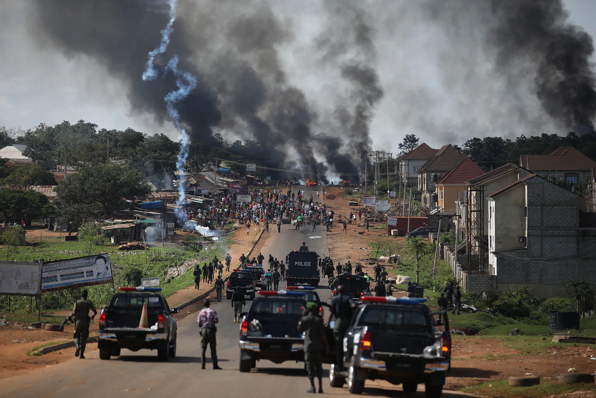 Nigerian police fire teargas during clashes in Abuja.