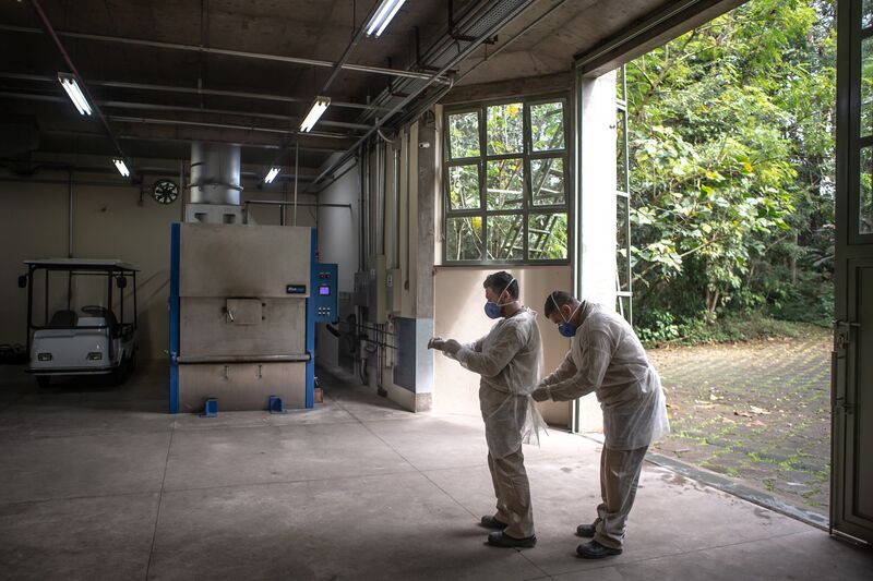 Workers don protective gear at the Horto da Paz crematorium in Sao Paulo, Brazil, on Friday, June 5, 2020. 