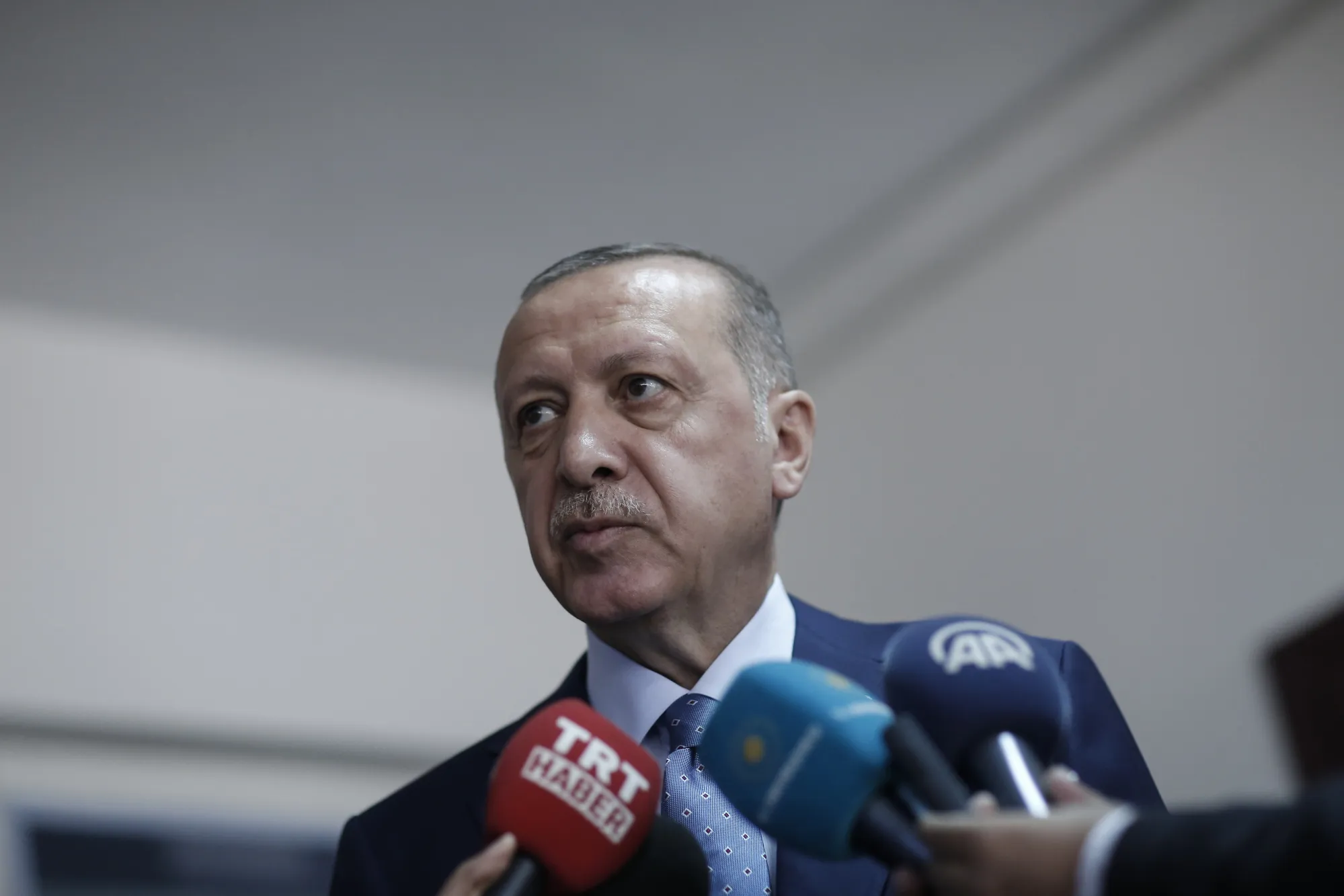 Recep Tayyip Erdogan, Turkey's president, speaks to members after casting his vote at a polling station during parliamentary and presidential elections in the district of Uskudar, Istanbul, Turkey, on Sunday, June 24, 2018.&nbsp;