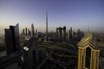 The Burj Khalifa tower, center, stands among city skyscrapers in Dubai, United Arab Emirates.