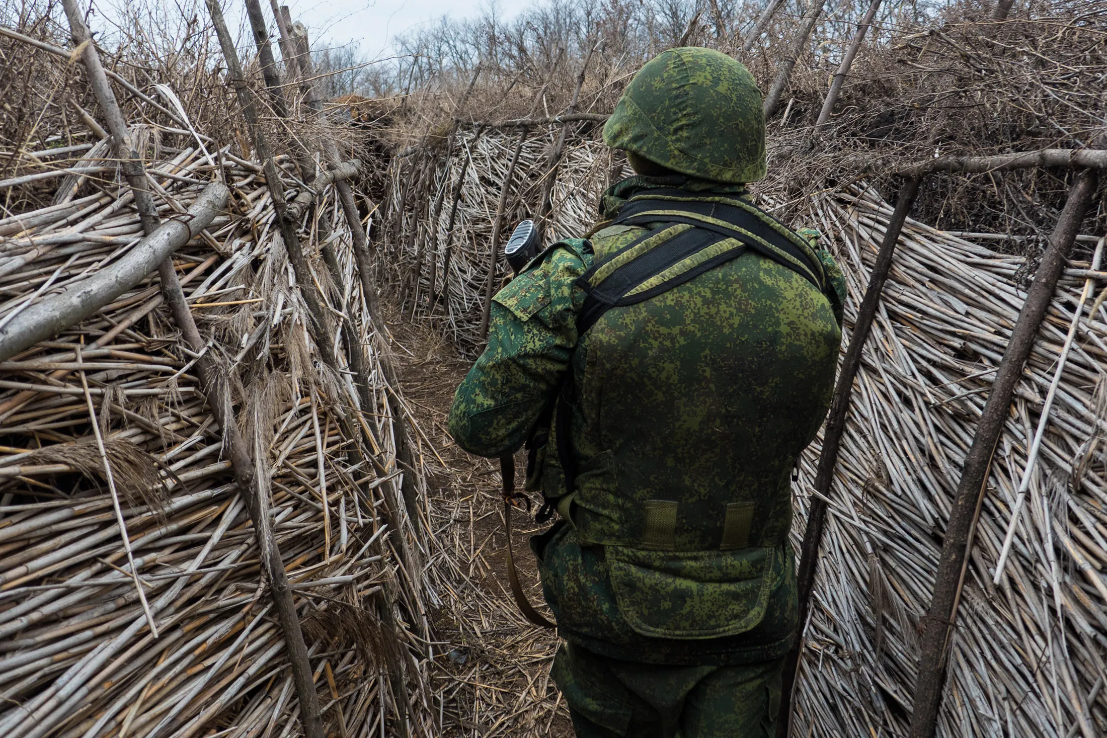 A soldier walks in trenches at Alexandrovka, the place where Donetsk forces stopped advance of Ukrainian army into the city.&nbsp;