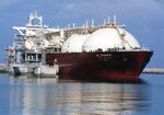 This undated file photo shows a Qatari LNG tanker ship being loaded up with LNG at Raslaffans Sea Port, northern Qatar. 