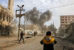 Smoke plumes rise following a reported regime air strike in the rebel-held enclave of Jisreen in the Eastern Ghouta near Damascus, Syria on Feb. 8, 2018. 