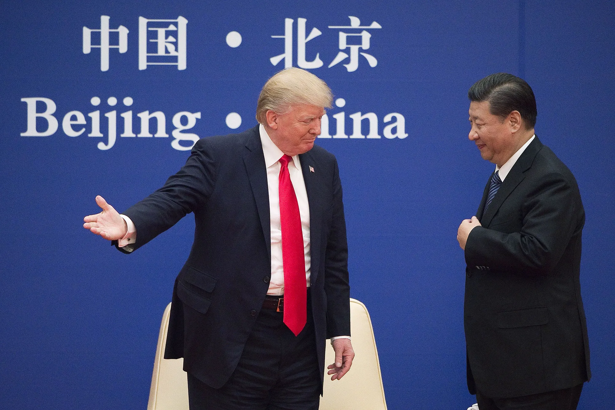 U.S. President Donald Trump gestures to China's President Xi Jinping during a business leaders event in November 2017.