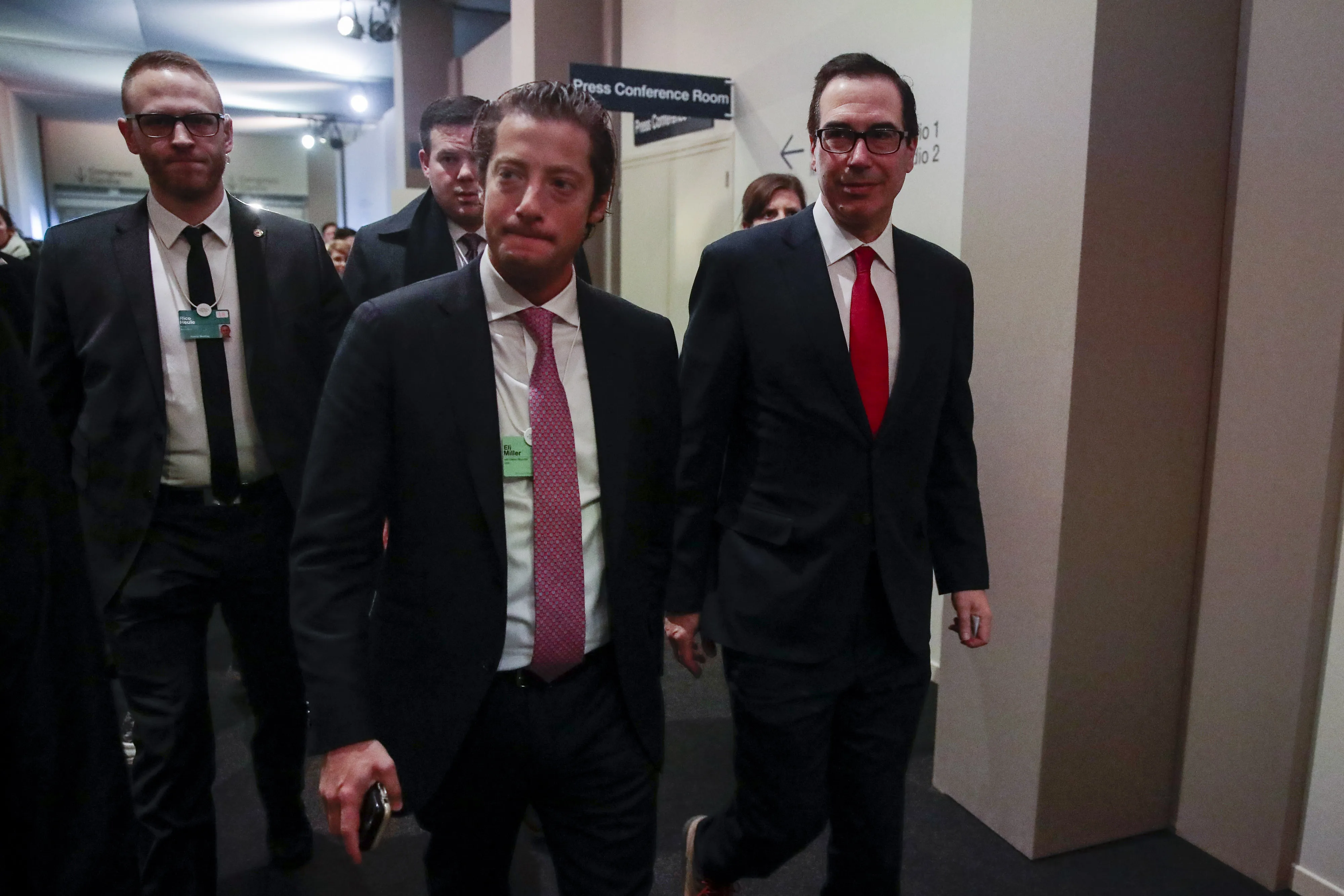 Steven Mnuchin,, right, arrives for a press briefing in Davos&nbsp;on Jan. 25.