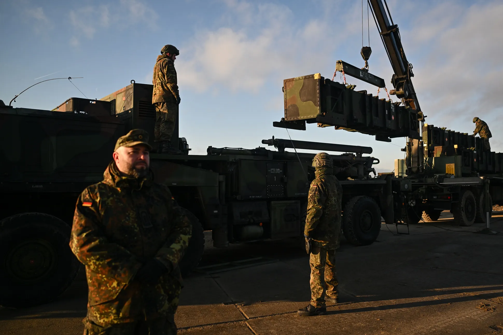 German soldiers unload the US made MIM-104 Patriot surface-to-air missile system in Jasionka, Poland in January 2023.