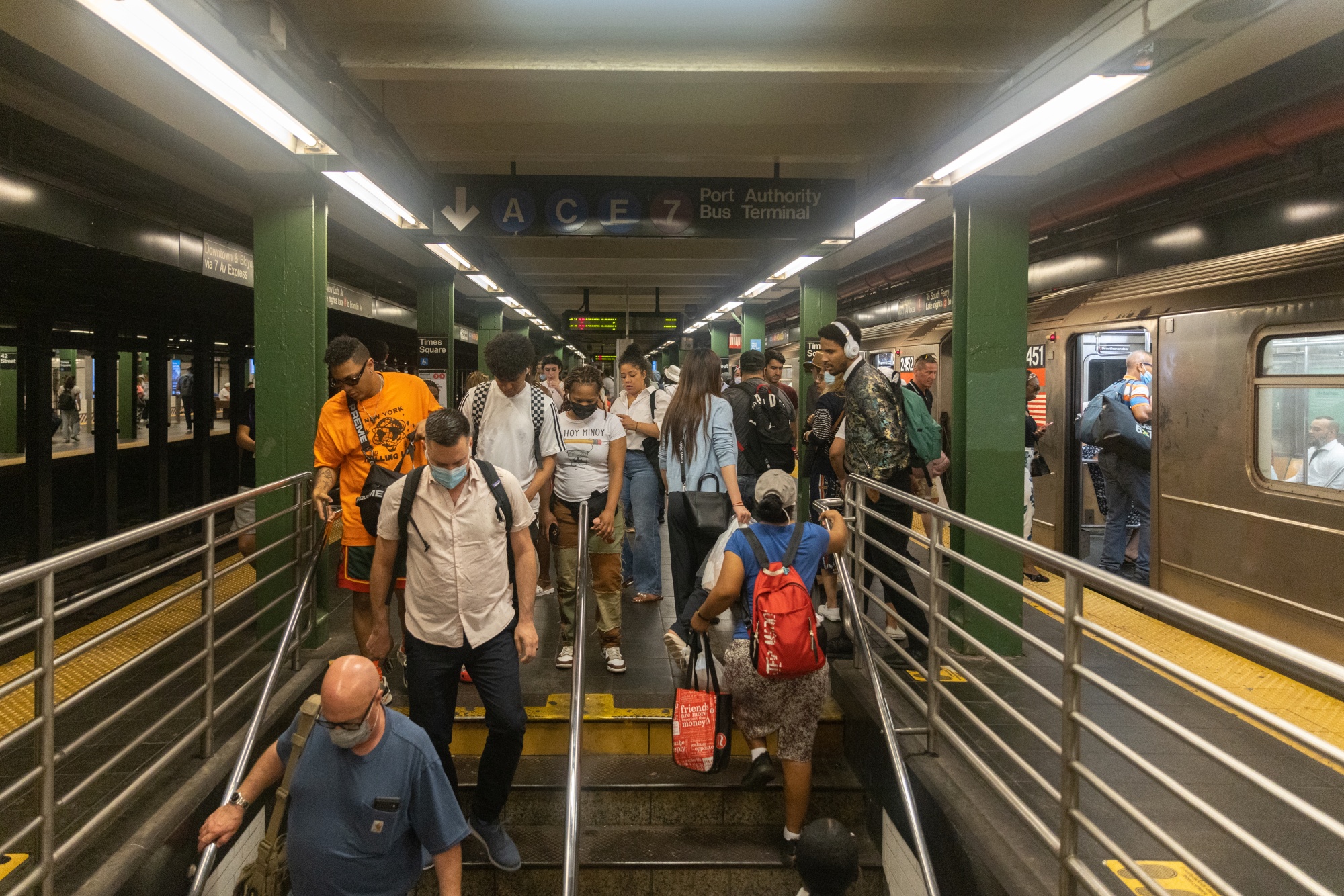 Commuters exit a subway station in New York, on&nbsp;June 30.