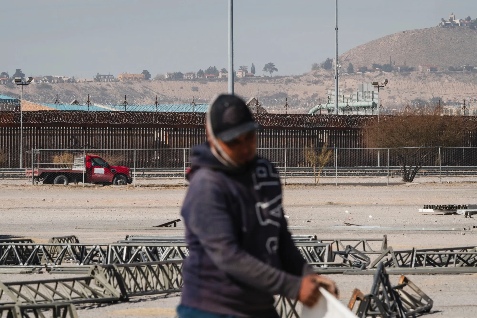 A worker assembles temporary shelters in preparation for mass deportations at the US-Mexico border in Ciudad Juarez, Chihuahua state, Mexico.