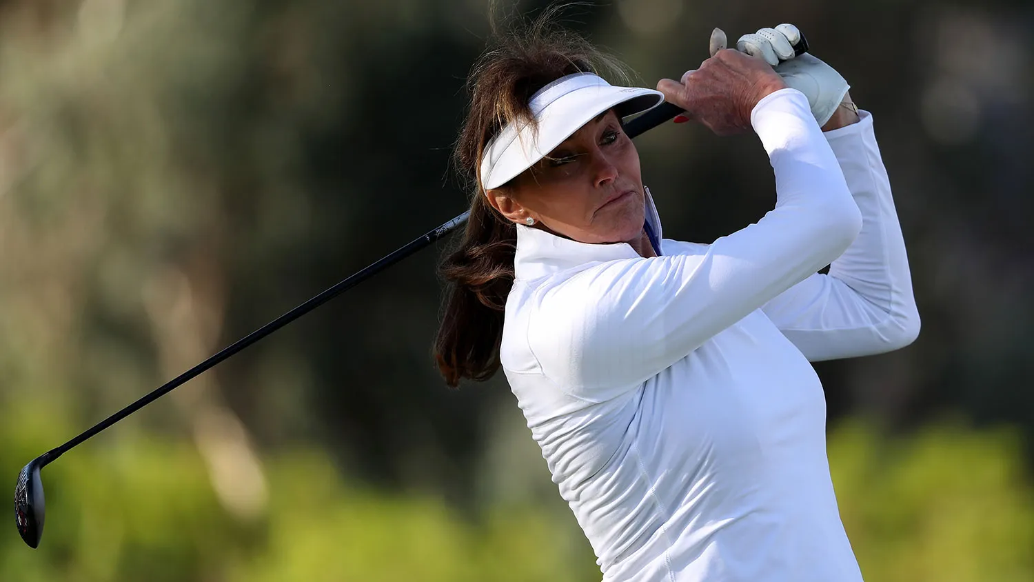 Caitlyn Jenner tees off on March 30, 2016, in Rancho Mirage, California.

