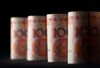 Chinese one-hundred yuan banknotes are arranged for a photograph in Tokyo, Japan, on Tuesday, Aug. 11, 2015. China devalued the yuan by the most in two decades, a move that rippled through global markets as policy makers stepped up efforts to support exporters and boost the role of market pricing in Asia's largest economy.