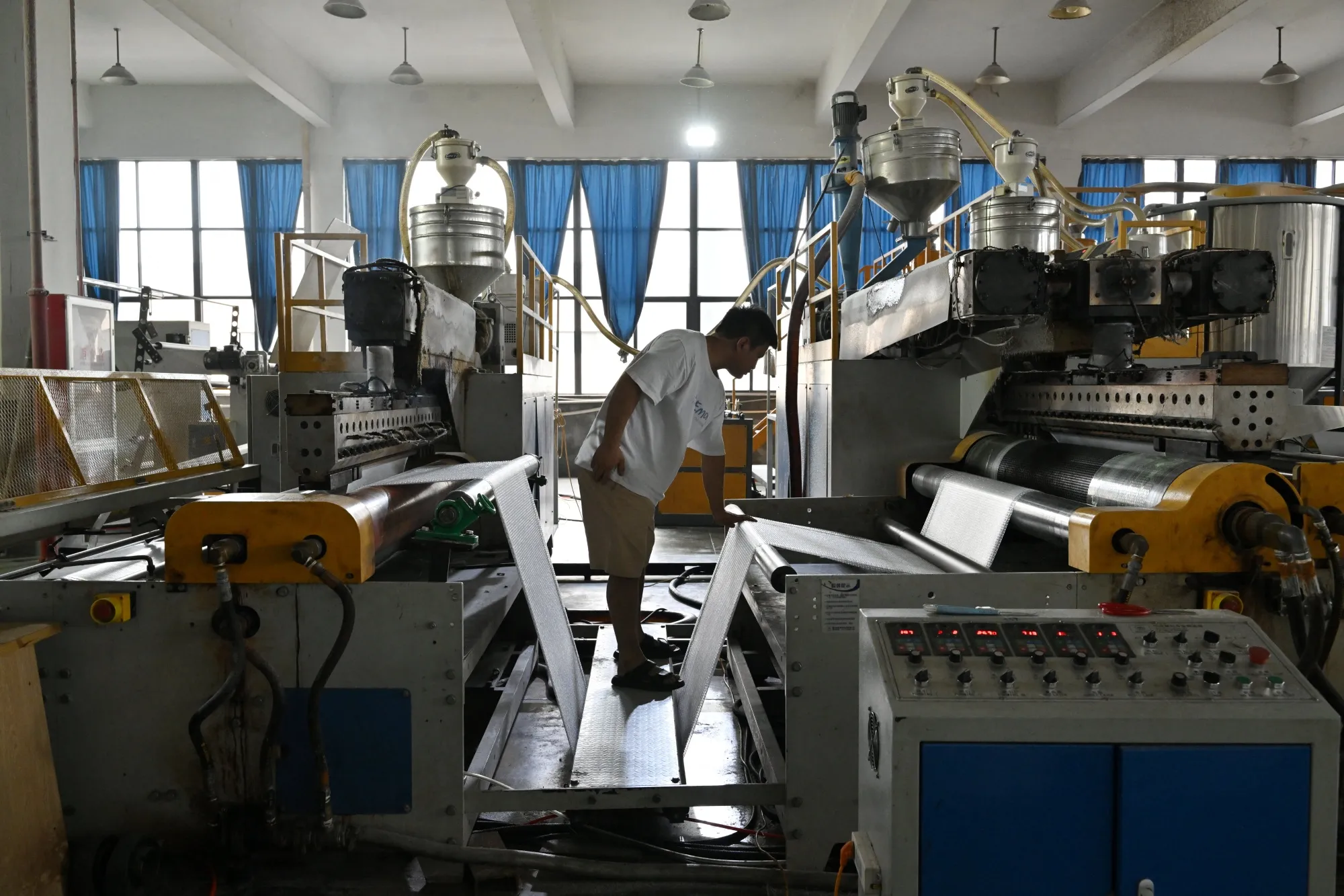 An employee works at a plastic factory in Yiwu, Zhejiang province.