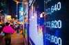 Digital sign displaying stock market data.