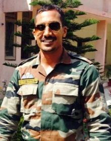An FBI handout photo Vikash Yadav outside wearing military fatigues and sunglasses