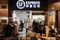 Customers line up at an S.F. Express store in Hong Kong. Photographer: Anthony Kwan/Bloomberg