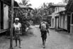 An ELN combatant walks through a village in northwest Colombia.