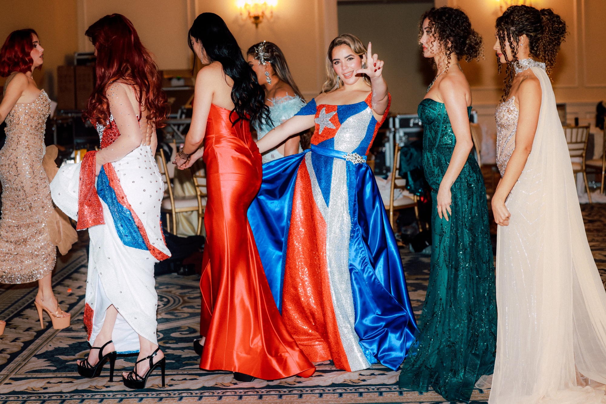 A contestant flashes the letter L, an opposition symbol for resistance to Cuba's regime, signifying