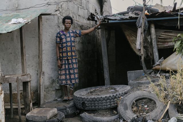 Cecilia Miguel outside her home that was damaged during Idai.