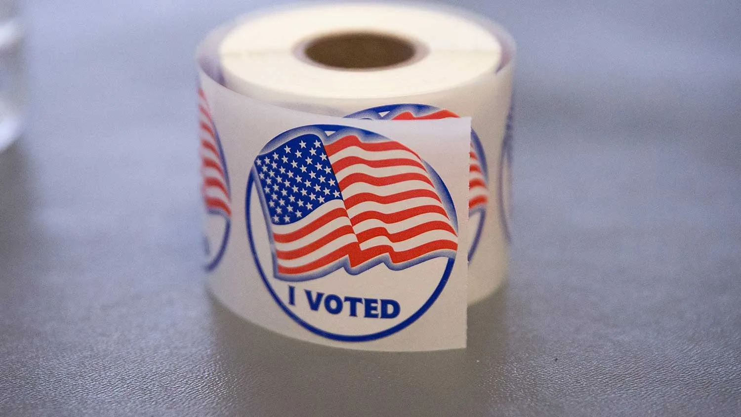 A roll of 'I Voted' stickers, which are handed out to residents after they vote, sit on an election officials table at a polling place on November 4, 2014 in Ferguson, Missouri.
