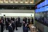 Participants observe social distancing measures as they look at a screen displaying share prices during a ceremony marking the first trading day of the year on the Tokyo Stock Exchange (TSE) in Tokyo, Japan, on Monday, April 4. January 2021. suffering after a report Prime Minister Suga may declare a state of emergency for Tokyo.