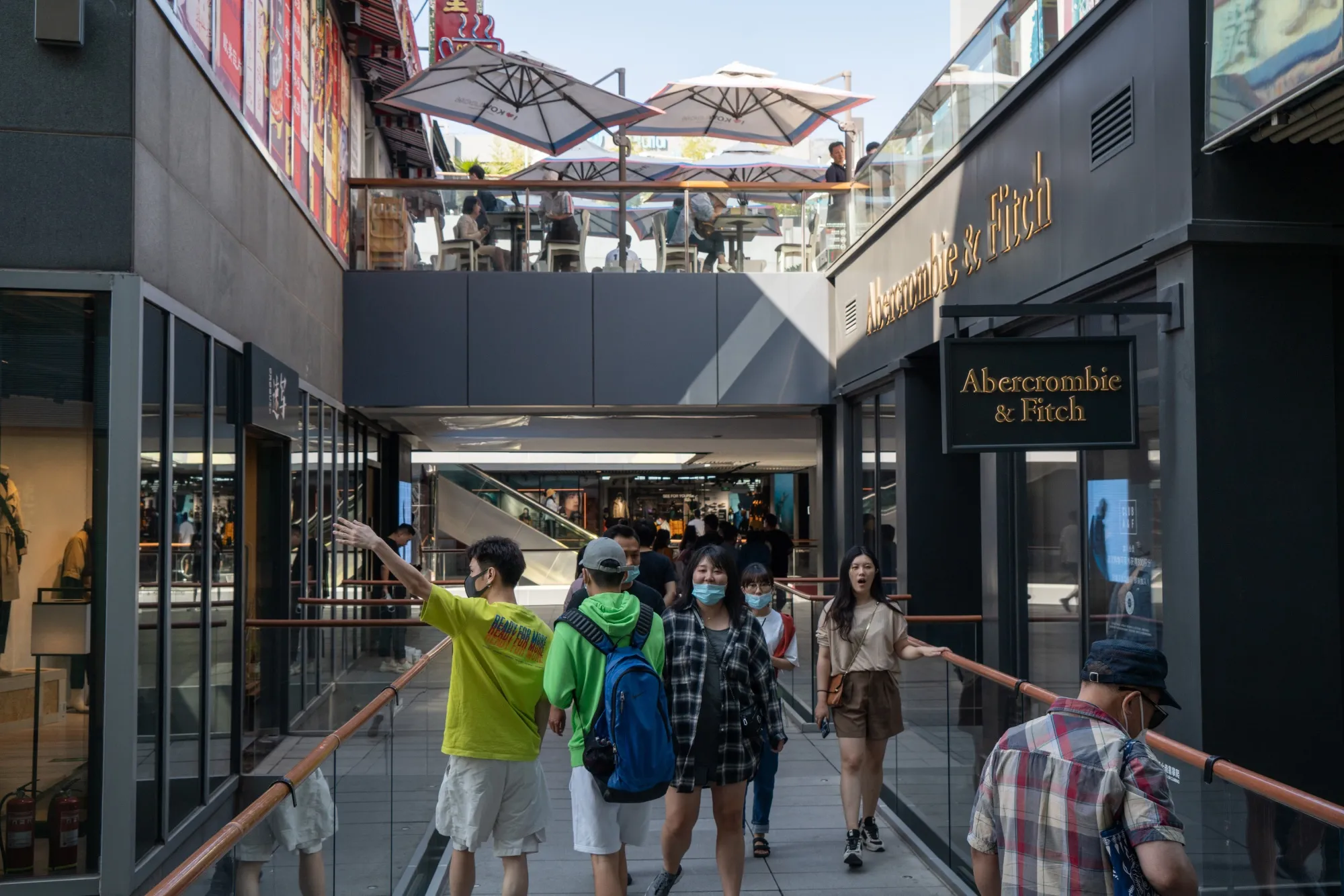 Shoppers browse stores in Beijing, China on Sept. 20.