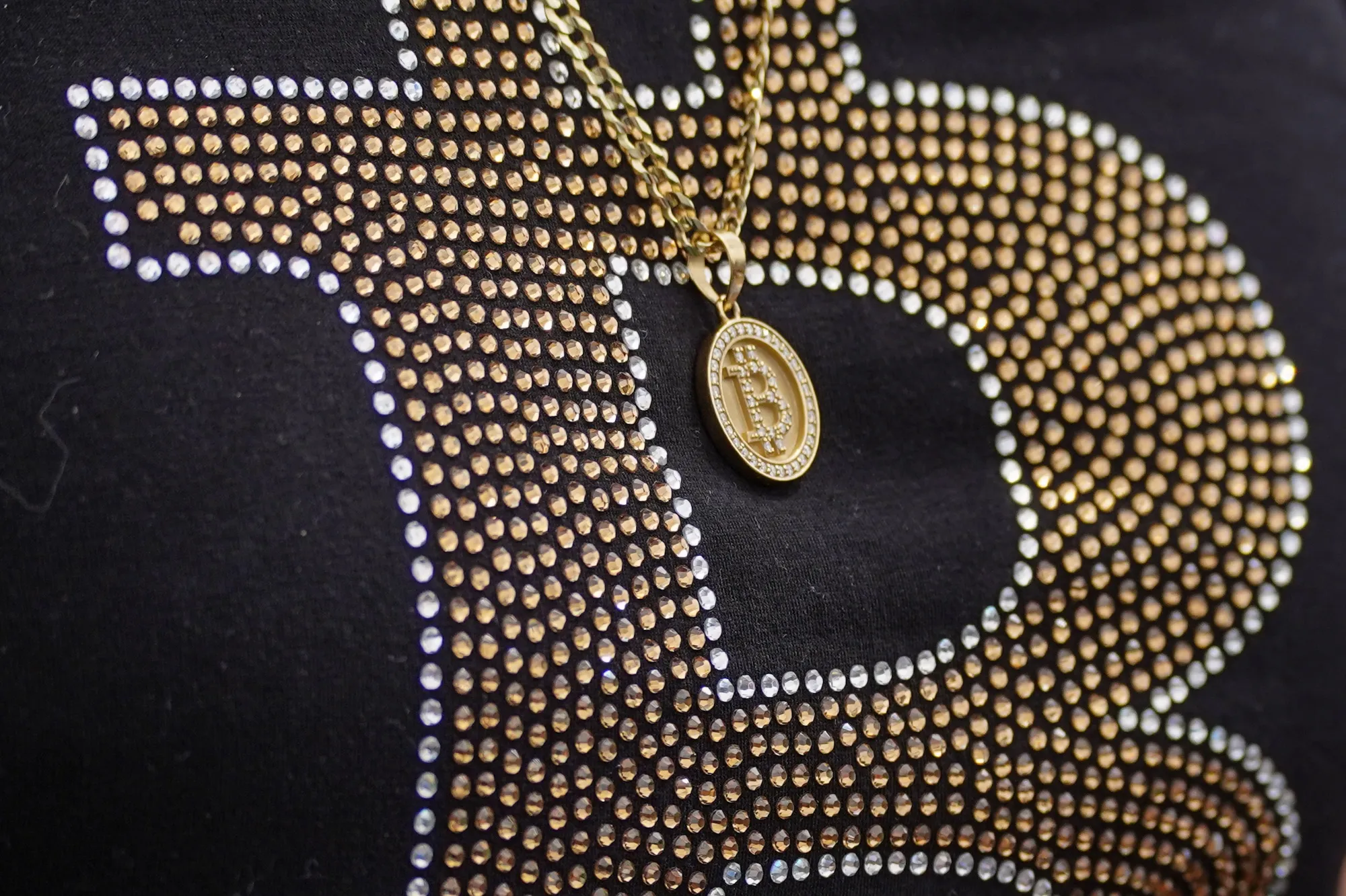A necklace depicting the Bitcoin logo at the Plan B Forum in San Salvador, El Salvador, in January.