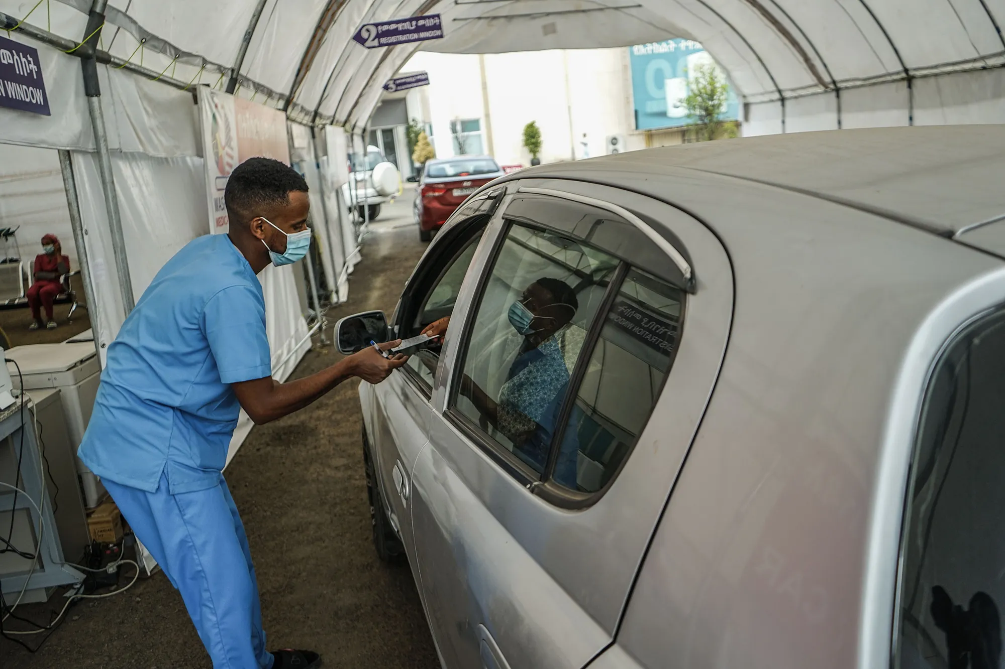 A medical worker collects a swab sample from a person at a Covid-19 testing center in Addis Ababa.&nbsp;