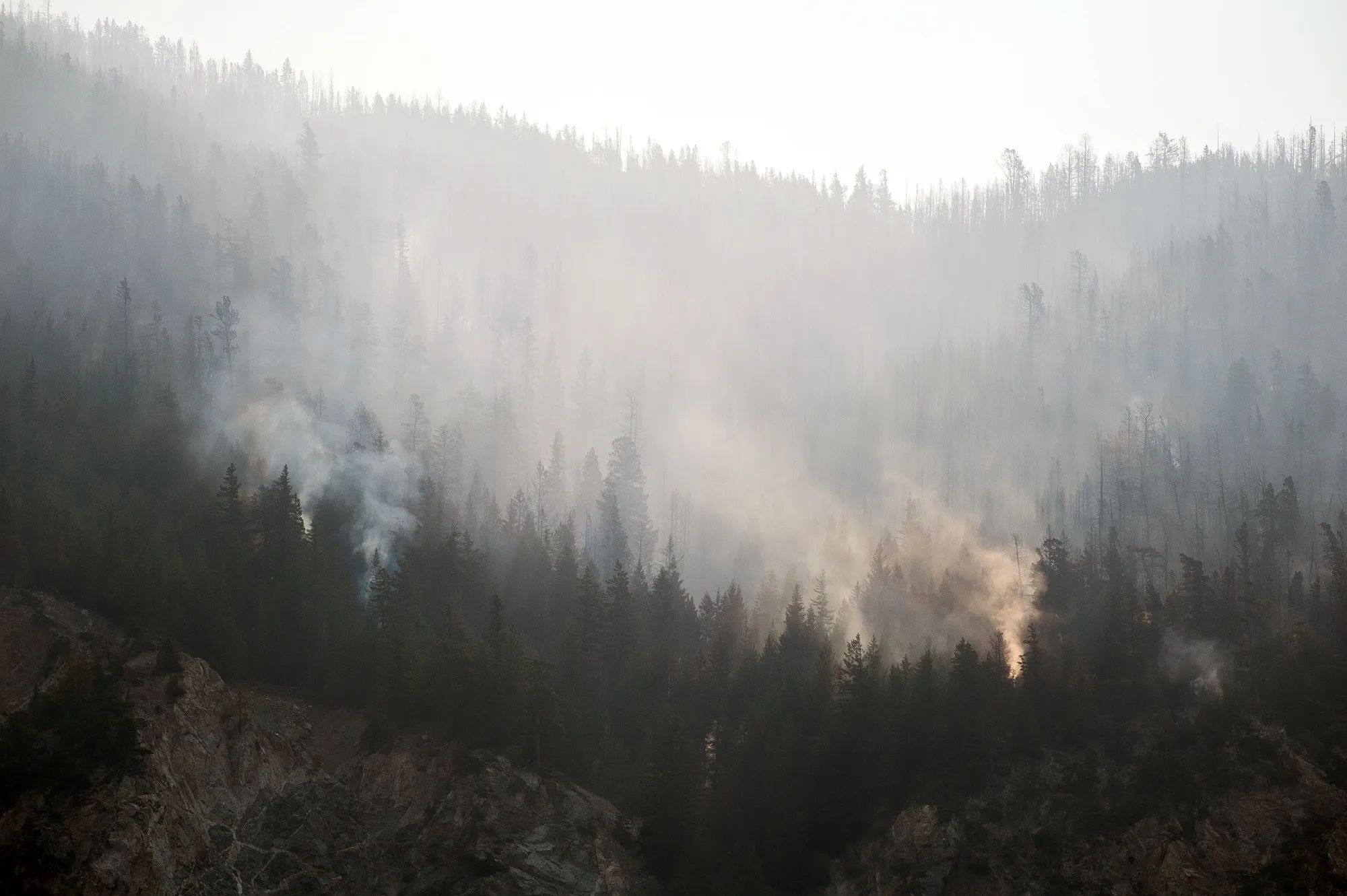 A wildfire burns above the Fraser River Valley near Lytton, British Columbia, Canada, on July 2.