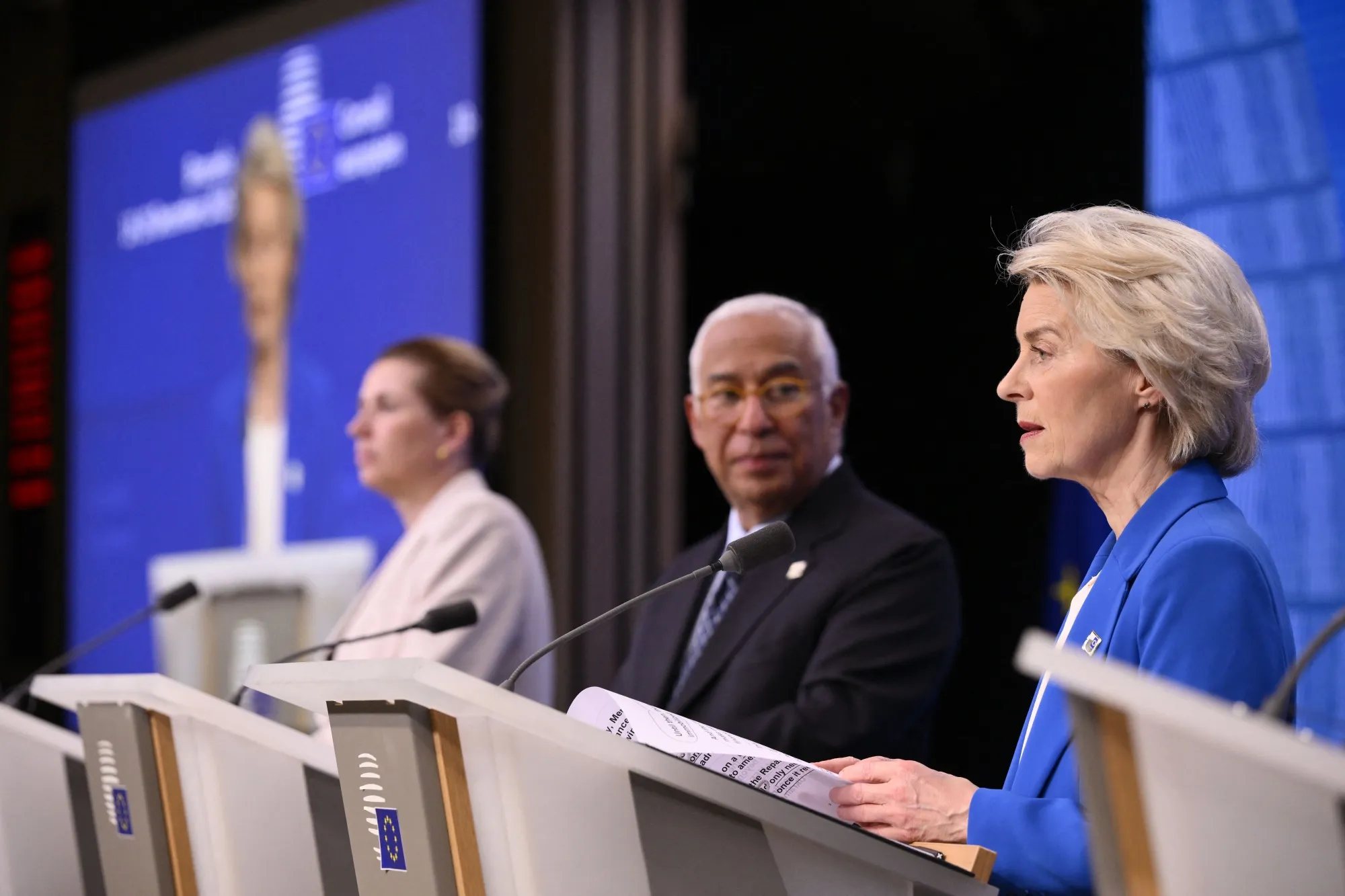 European Commission President Ursula von der Leyen, right, speaks as European Council President Antonio Costa, center, and Denmark's Prime Minister Mette Frederiksen listen&nbsp;after the European Council meeting regarding a loan to Ukraine in Brussels on Dec. 19, 2025.