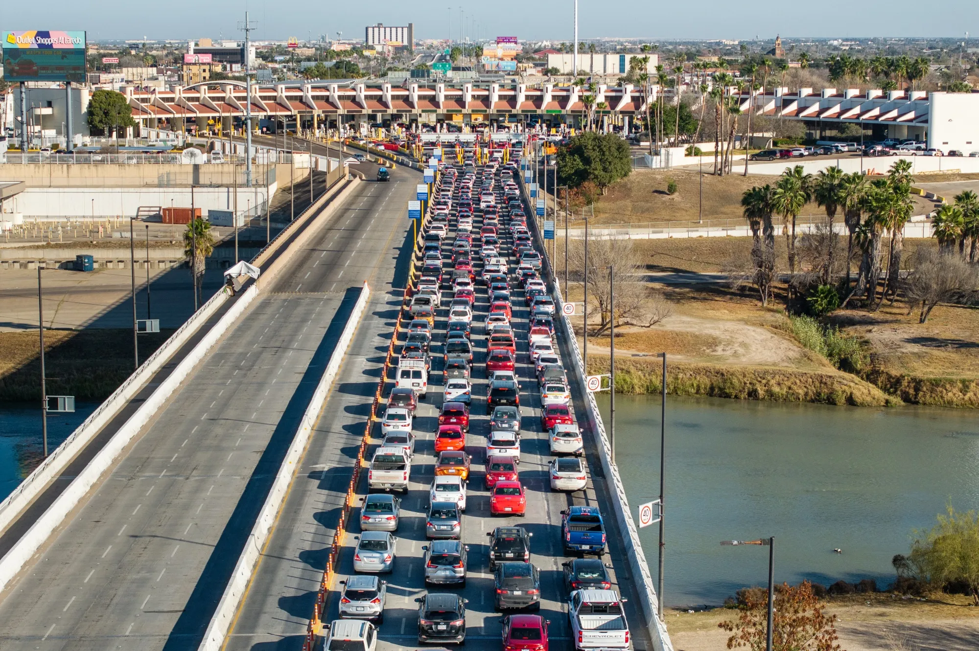 Vehicles wait to cross the US-Mexico border in Laredo, Texas, on Feb. 3.