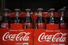 Bottles of Coca-Cola Co. soft drinks are displayed for sale at a store in Louisville, Kentucky, U.S., on Monday, Feb. 10, 2020. Coca-Cola rose after reporting better-than-expected revenue growth for the fourth quarter, citing rising demand overseas and higher demand for its low-sugar offerings in the U.S.