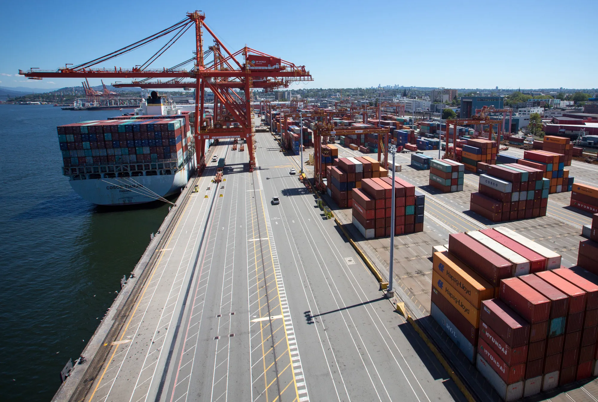 A cargo ship is unloaded at the Port of Vancouver terminal.
