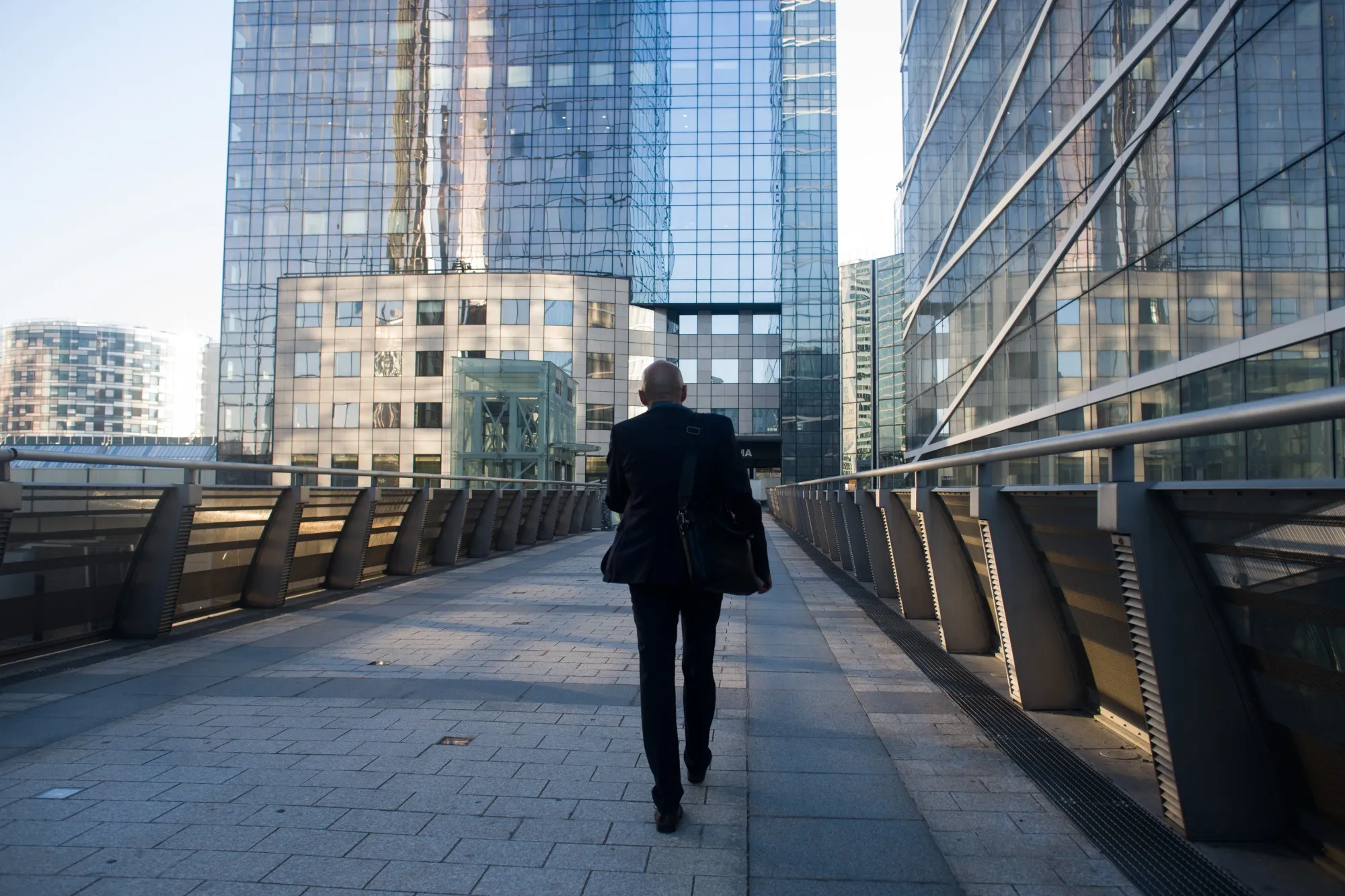 An office worker commuting to work in La Defense financial district of Paris, France.