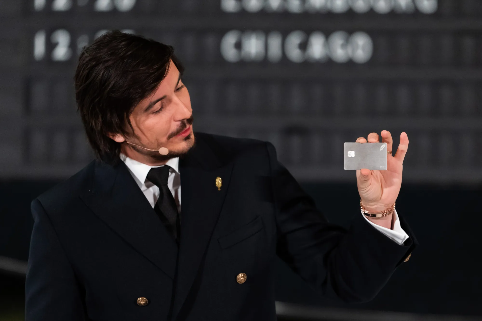 Robinhood Markets CEO Vlad Tenev holds a Robinhood Platinum credit card during a media event in New York on March 4.