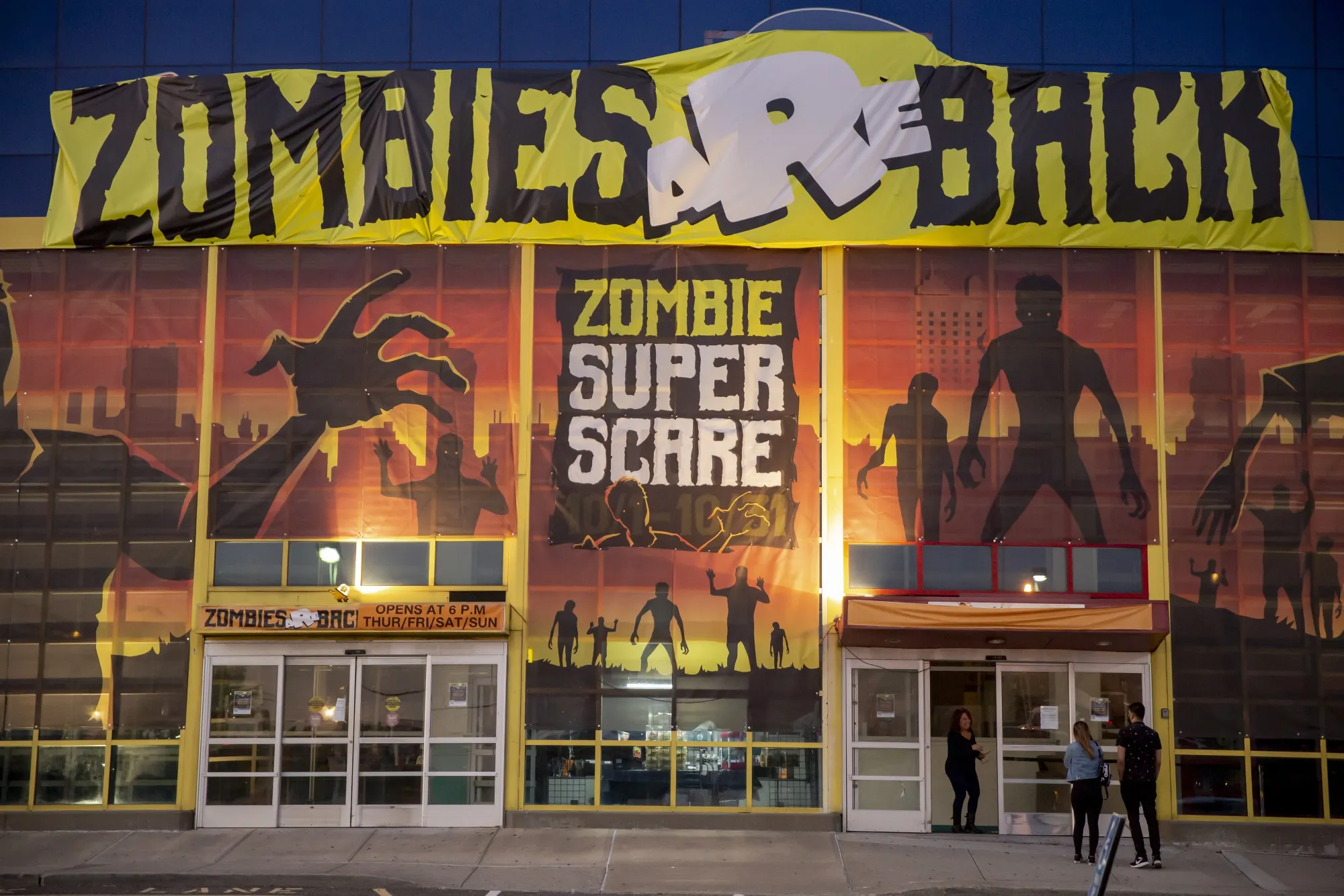 Guests enter the Zombies Are Back haunted house in the Queens borough of New York.