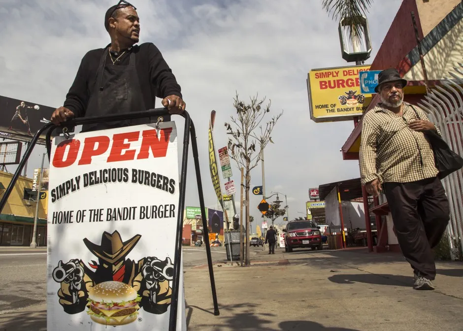 Maurice Thrower, co-owner of Simply Delicious Burgers, which is sandwiched between two fast-food chain restaurants, said he offers healthier fare such as vegetarian and turkey burgers in L.A.'s Leimert Park neighborhood.