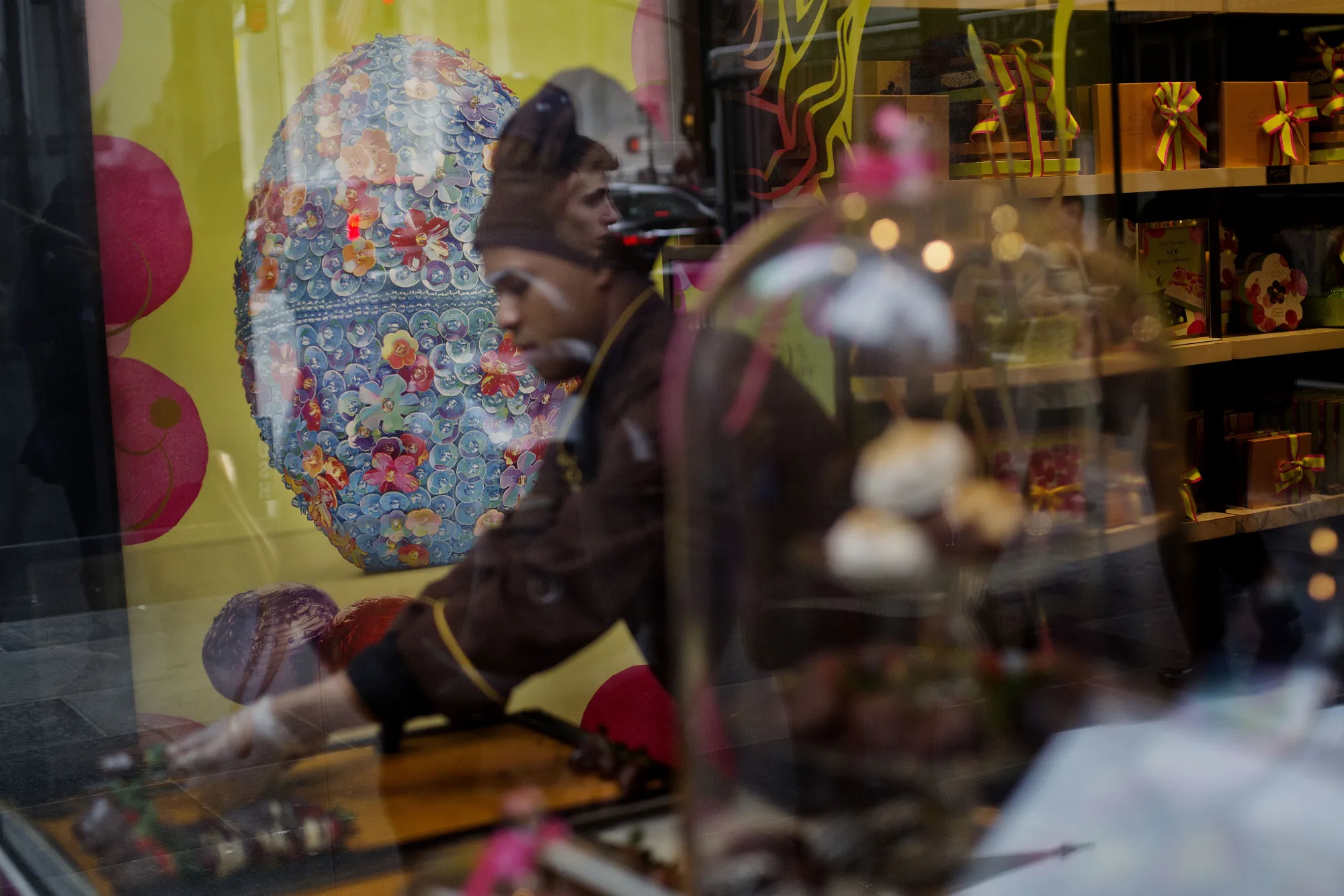 A worker prepares chocolates inside a Godiva Chocolatier Inc. store on Fifth Avenue in New York.