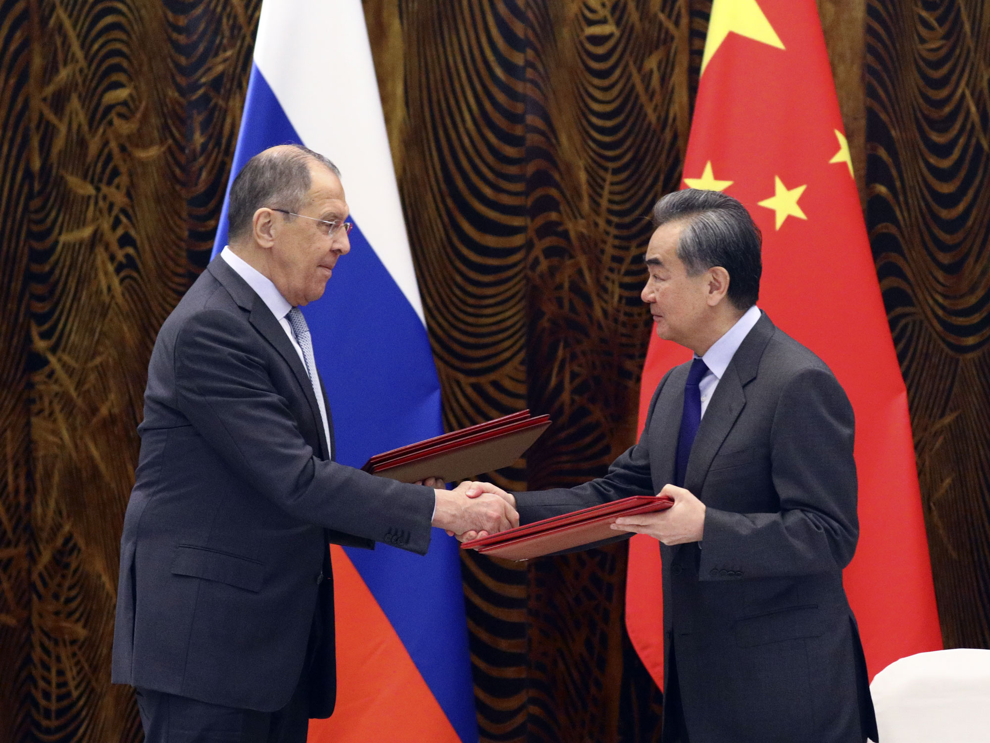 Wang Yi, right, and Sergei Lavrov during a signing ceremony in Beijing on March 23.