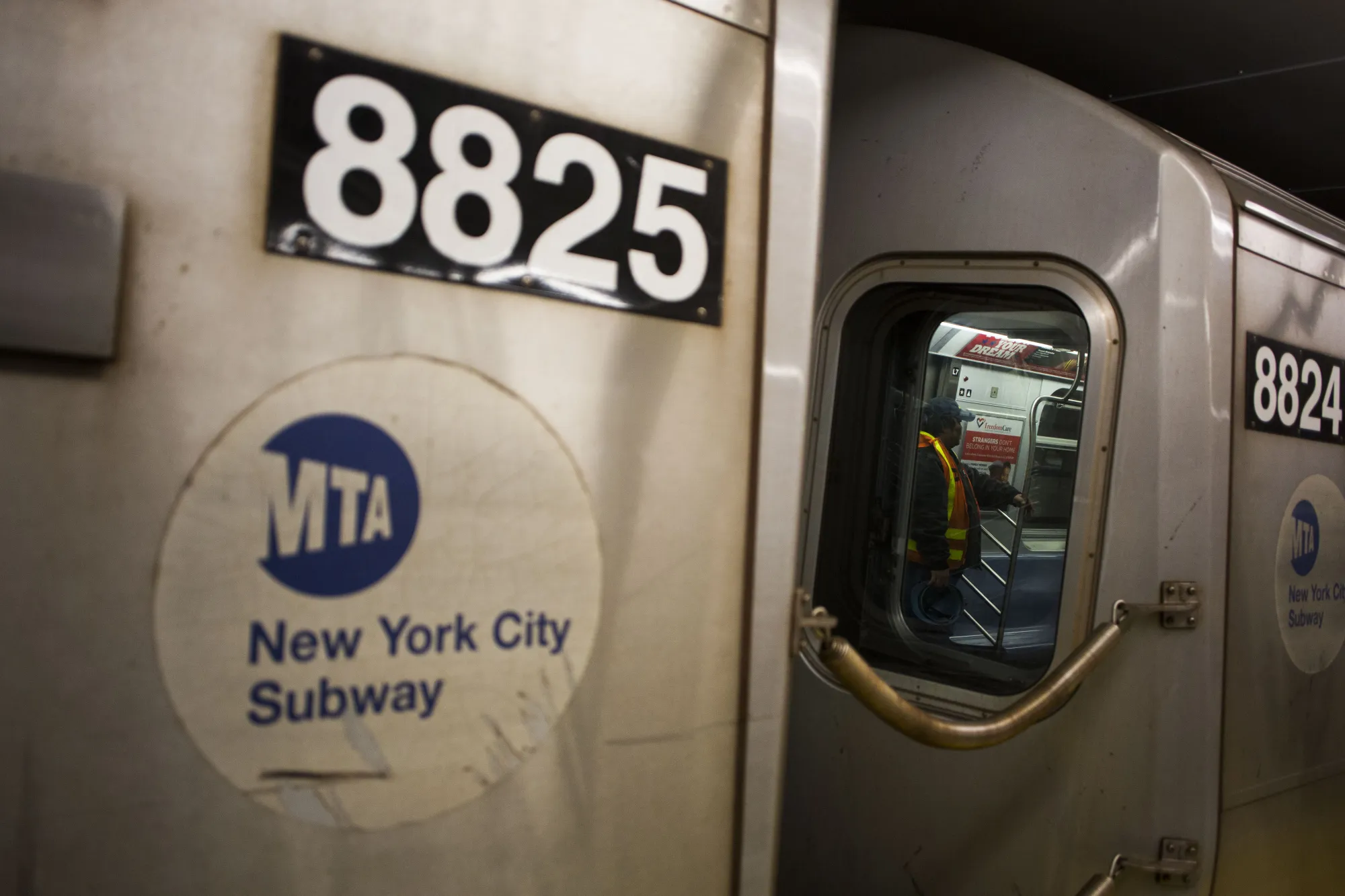 An MTA employee on a&nbsp;subway line in New York City.&nbsp;