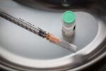 A syringe sits alongside a vial in a kidney dish in this arranged photograph taken at the Chaika Clinic in Moscow, Russia, on Monday, Aug. 10, 2020. Russia registered its first coronavirus vaccine, President Vladimir Putin said during a televised meeting with the government.