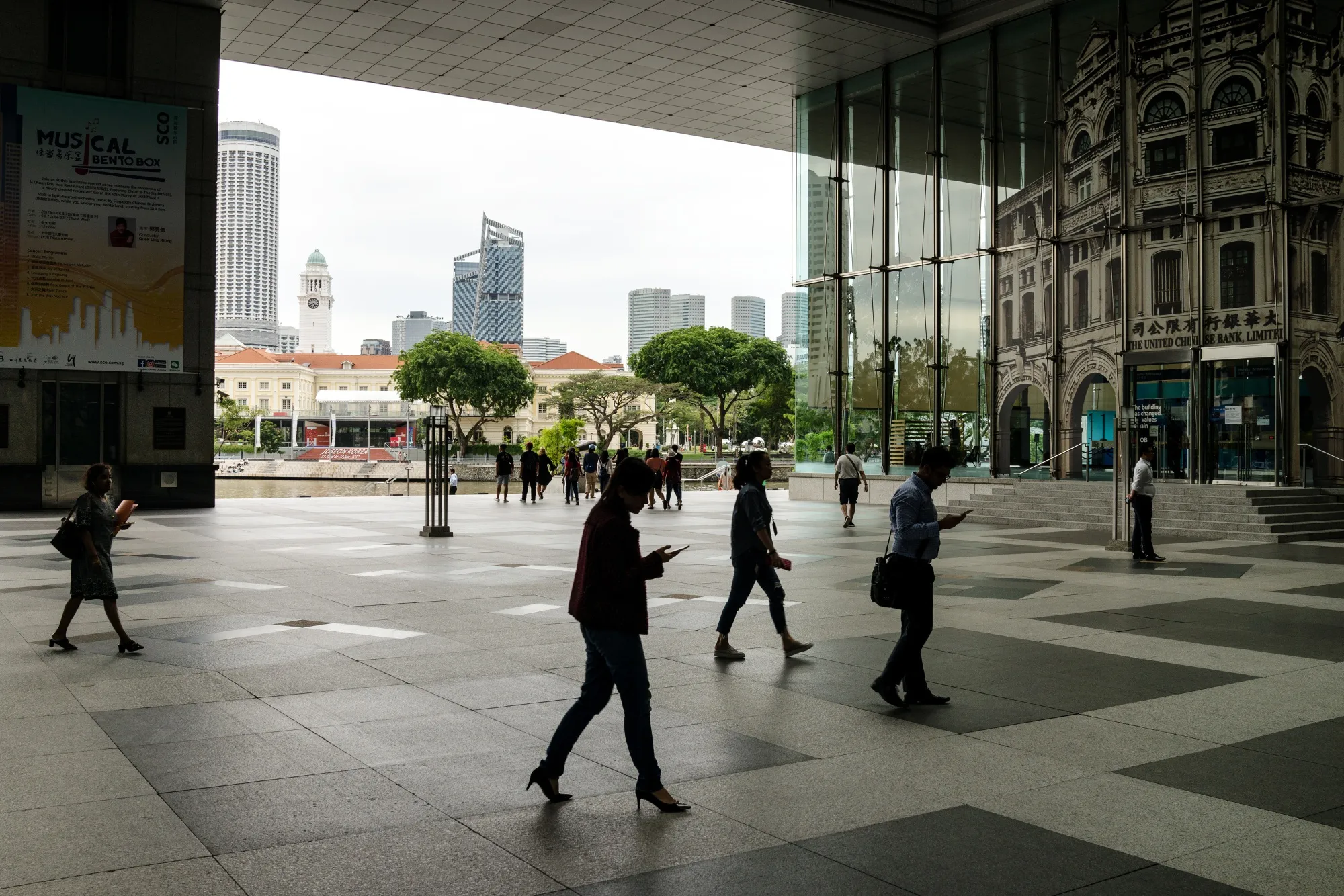 Pedestrians walk in the central business district of Singapore.