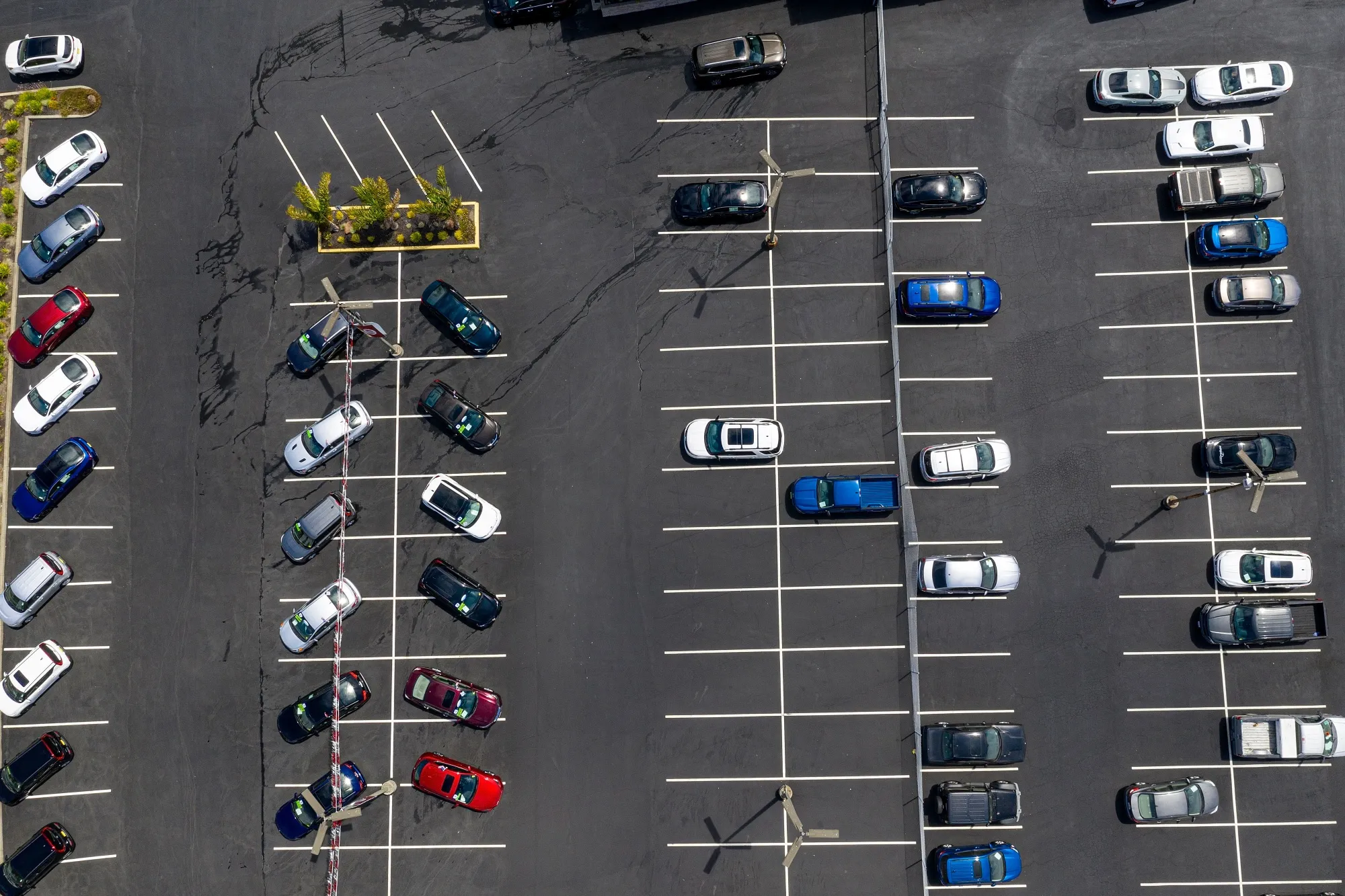 Vehicles in a nearly empty lot at a car dealership in Richmond, California, on July 1