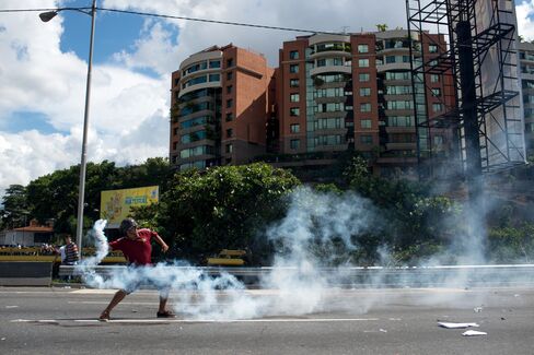 An opposition supporter clashes with police during a protest in Caracas on Sept. 1.