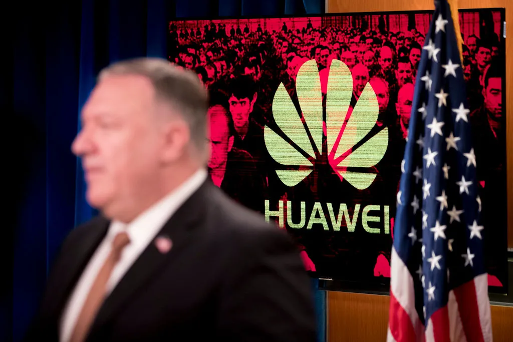 A monitor displays the logo for “Huawei” behind Secretary of State Mike Pompeo as he speaks during a news conference at the State Department in Washington,DC on July 15, 2020. (AFP Photo)
