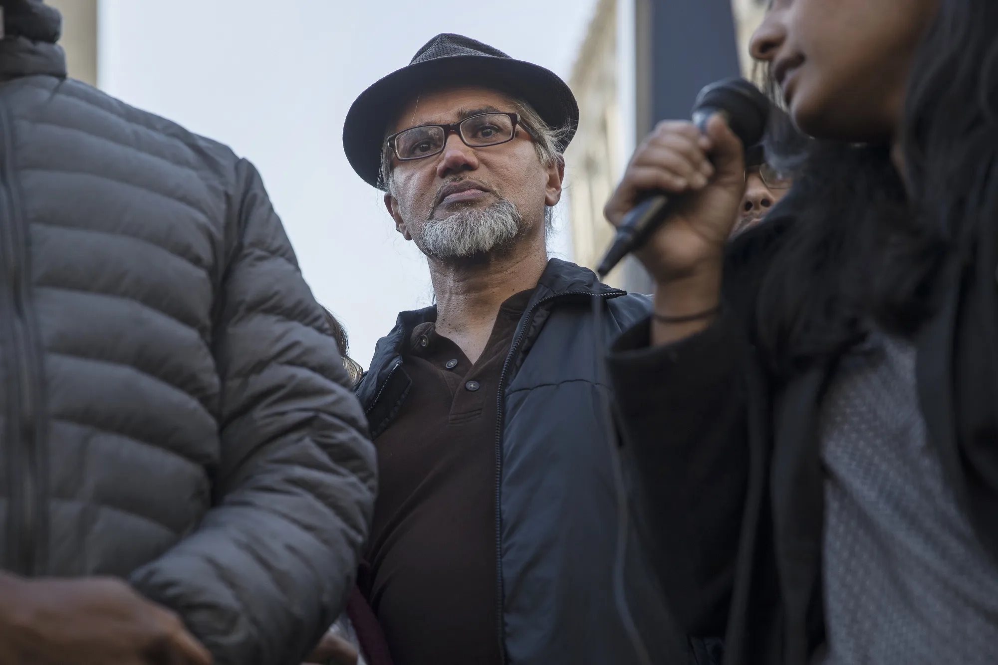 Immigration activist Ravi Ragbir, center, listens during a rally after a check-in with Immigration and Customs Enforcement (ICE) at the Jacob K. Javits Federal Building in New York, U.S., on&nbsp;March 9, 2017.