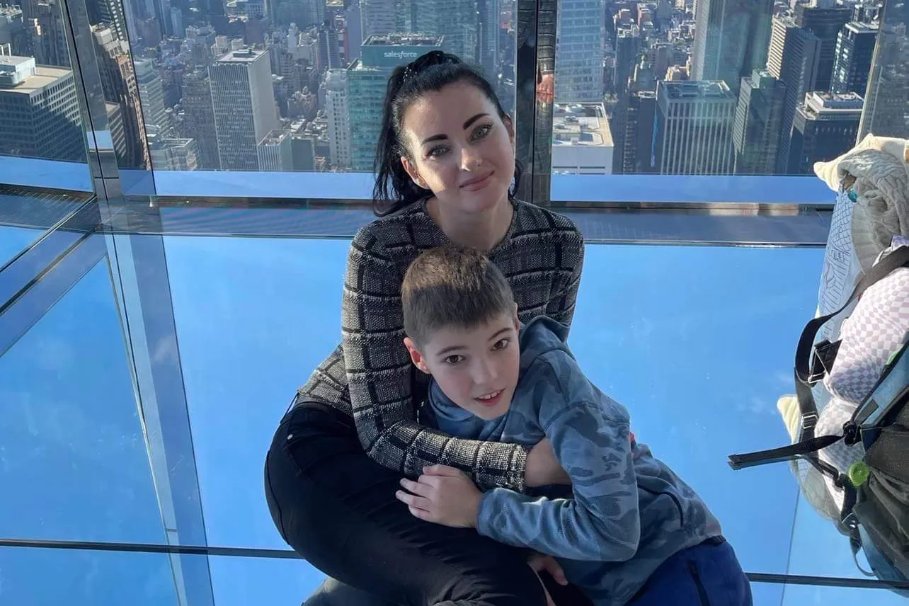 Kseniia Nadvotska and her son in New York City.